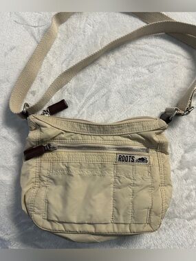 Y2K ROOTS cream camo lined mini crossbody purse.